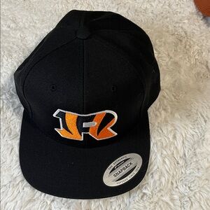 The Classic Black Hat with Orange Emblem